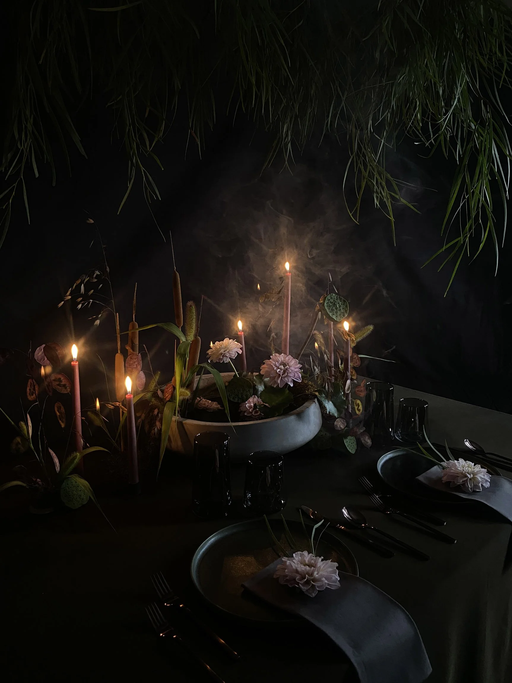 Mystical nighttime lily-pond-inspired dinner tablescape