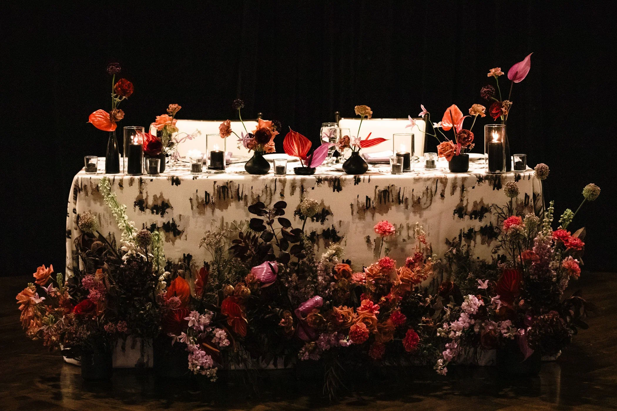 Dramatic florals cascading across a sweetheart table