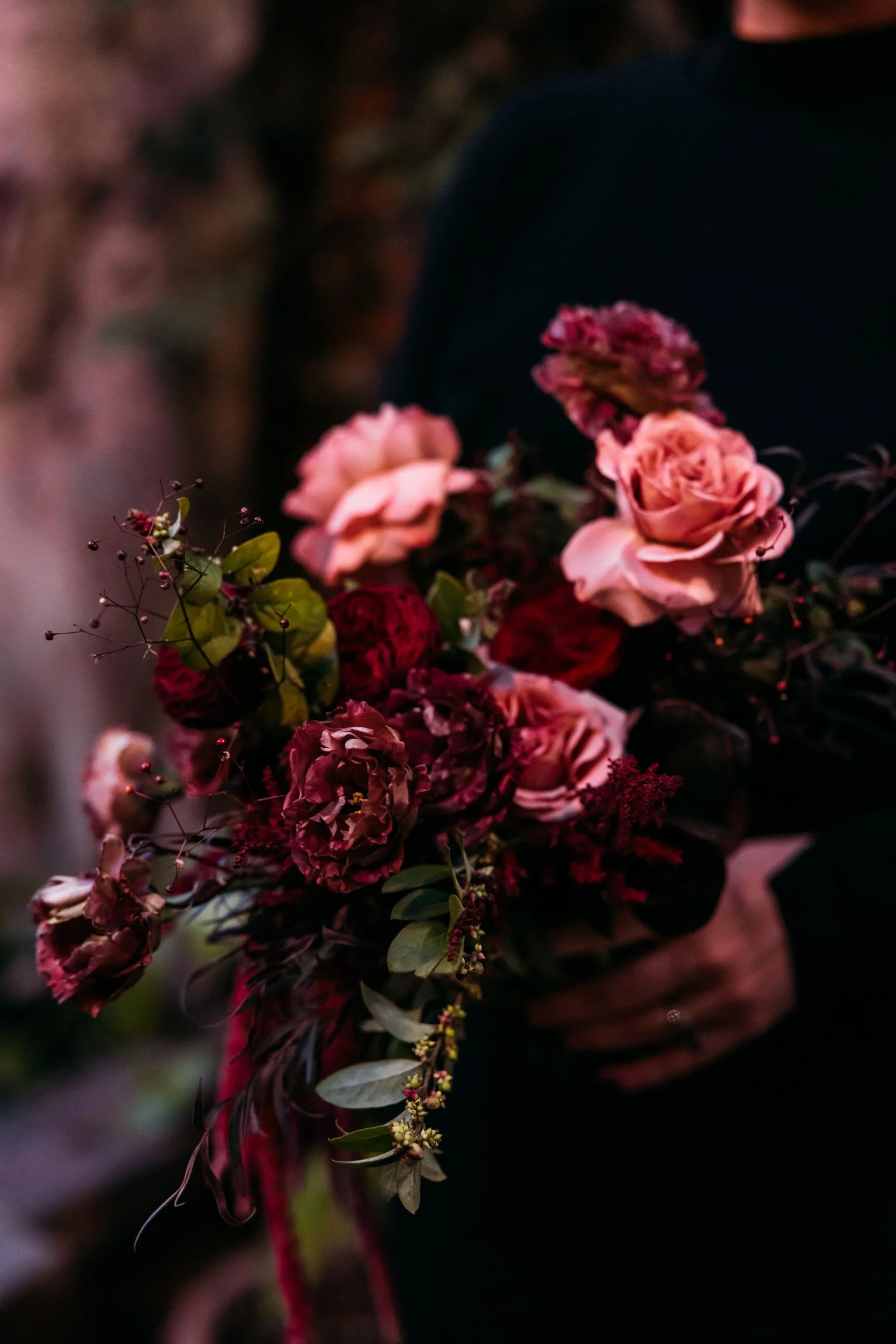 Dark, moody bouquet with rich hues and textured blooms