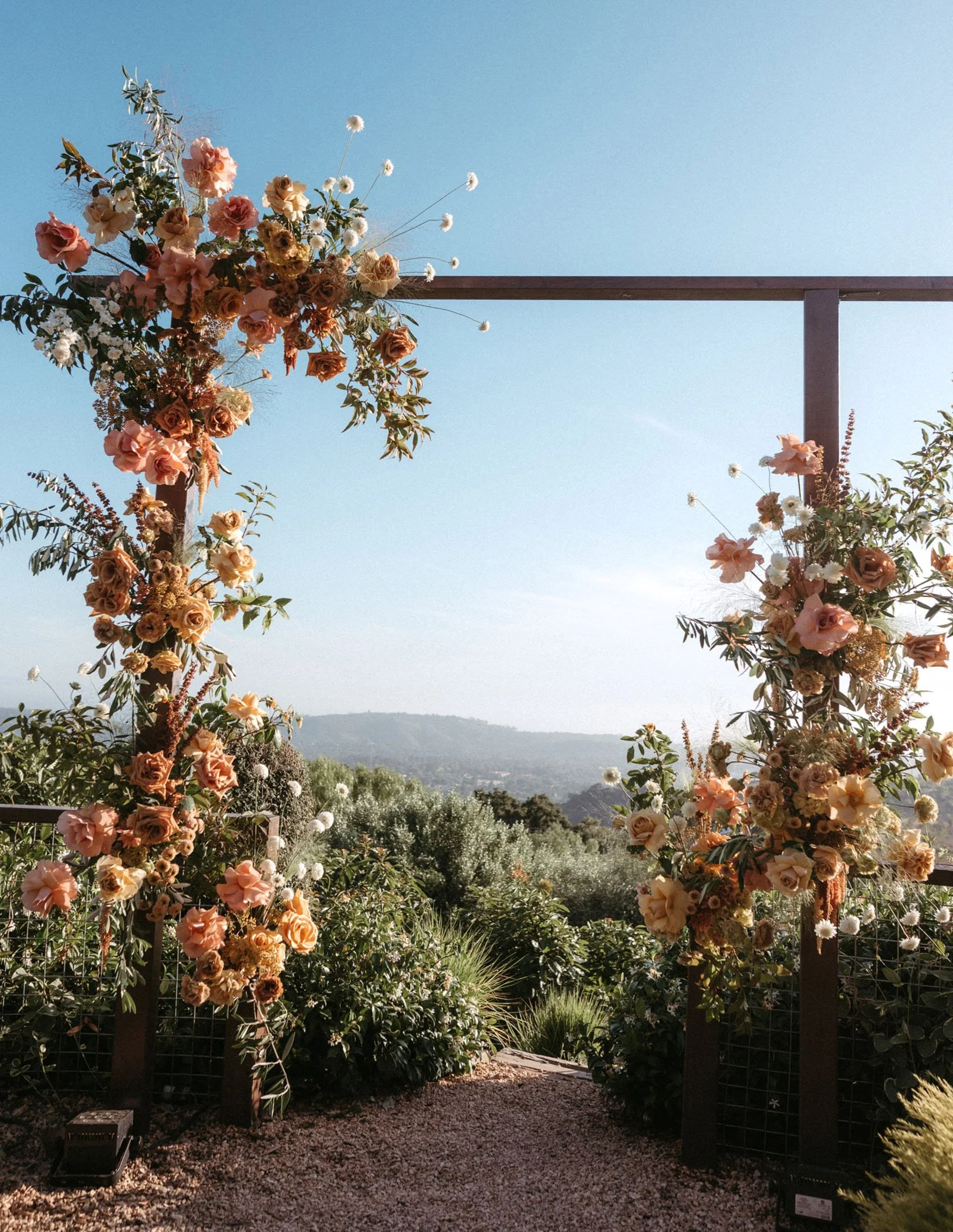 Santa Barbara outdoor wedding with a lush floral arch